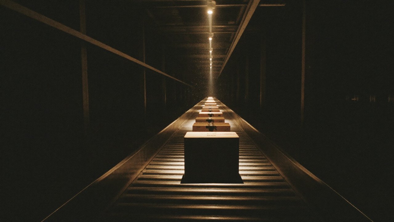 Warehouse interior with single spotlight on box